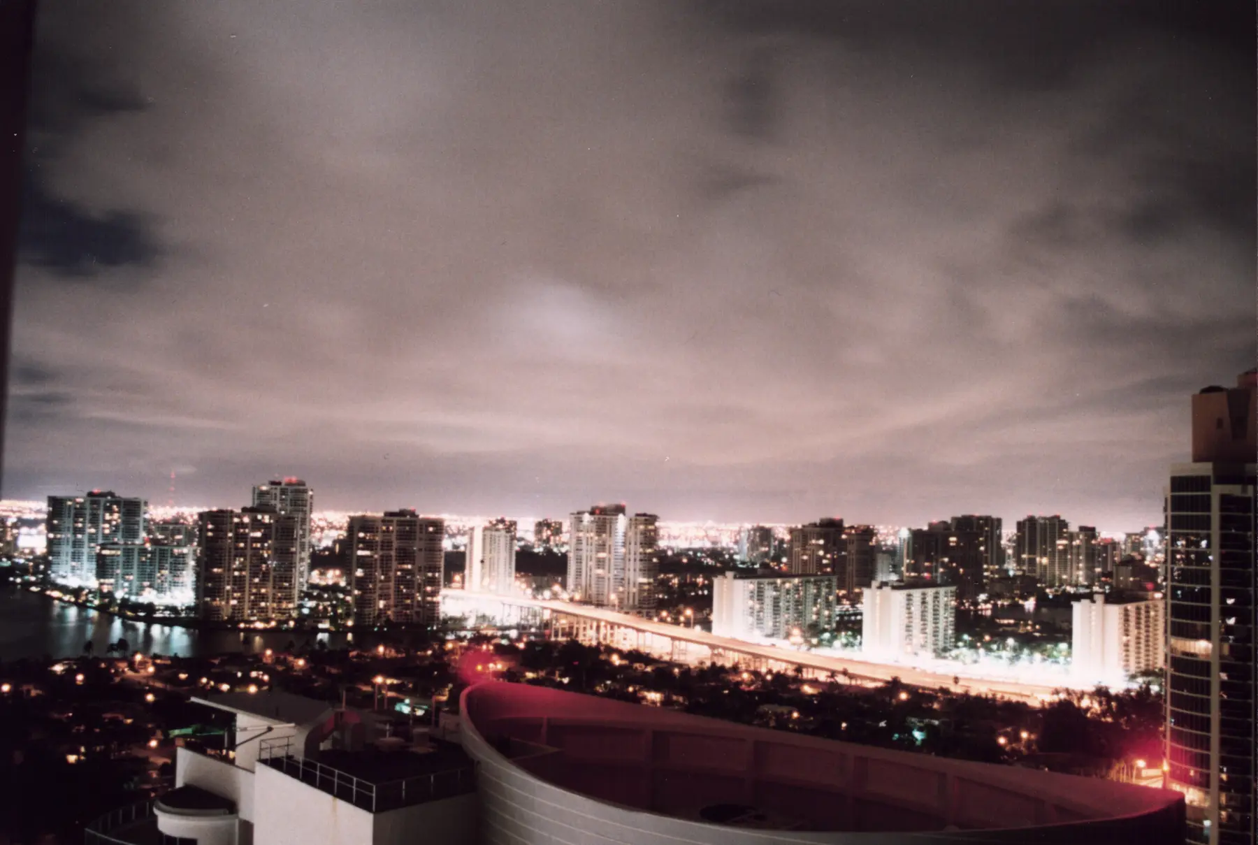 Aventura skyline glowing above the waterfront at dusk