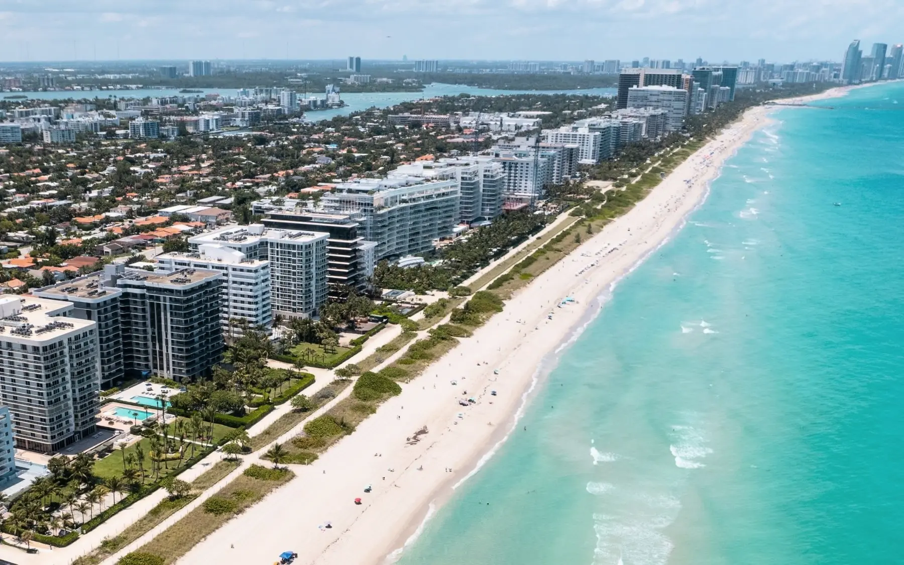 Aerial view of Surfside residences lining the turquoise Atlantic coast